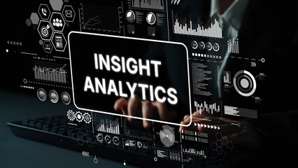 Business professional working on data analysis with insight analytics displayed on digital screen and graphs in background. Asymptotic smart data analytic.