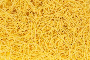 Raw vermicelli textured background, gold soup pasta pattern, small homemade noodles mock up, thin macaroni banner, Italian yellow filini pasta with copy space for text