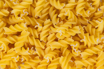 Fusilli doppia rigatura pasta background. Top view.