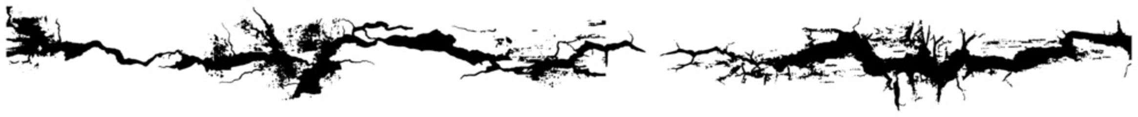 Cracked ground surface texture with black ink splatters