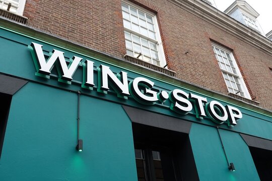 A storefront sign for a Wingstop restaurant, a fast-casual chain specialising in chicken wings
