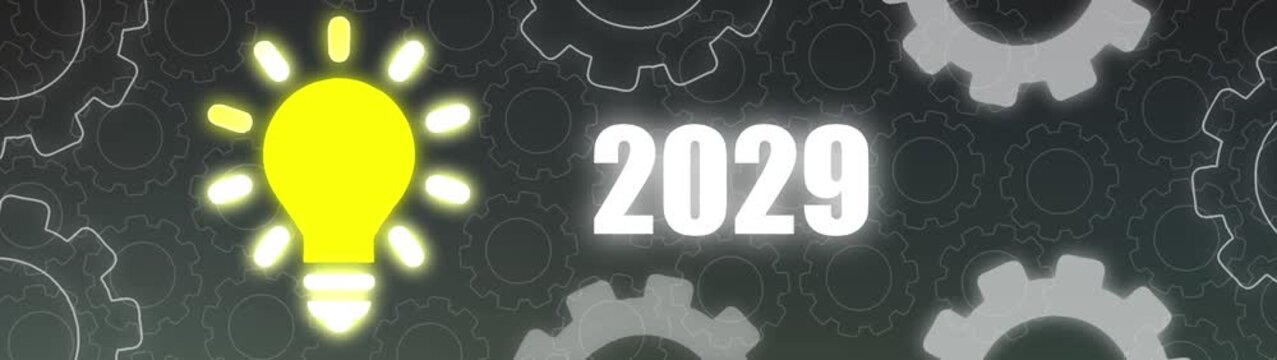 Bright yellow light bulb illuminates the year 2029 against a dark background of interlocking gears idea