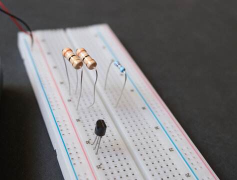 Resistors on the solderless breadboard. Electronic education or electrical experiments concept