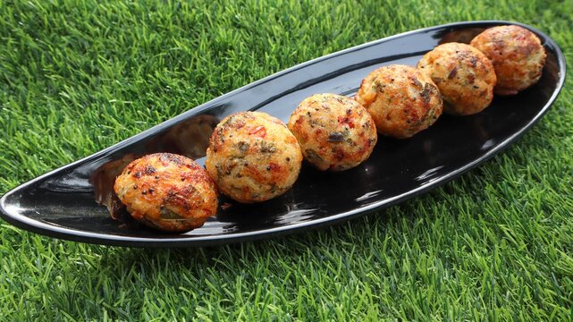 Tasty Paddu , appe, paniyaram made with mix vegetables and semolina.