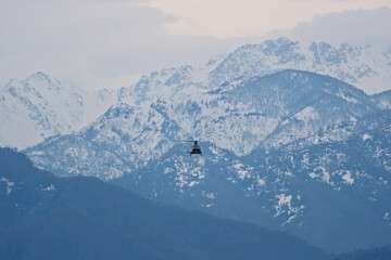 Helicopter Flying Over Snow-Capped Caucasus Mountains in Winter, Georgia