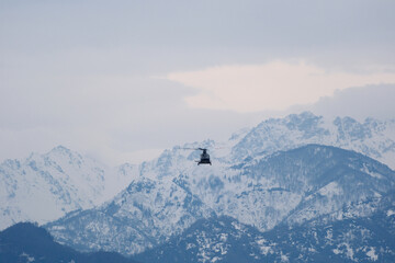 Helicopter Flying Over Snow-Capped Caucasus Mountains in Winter, Georgia