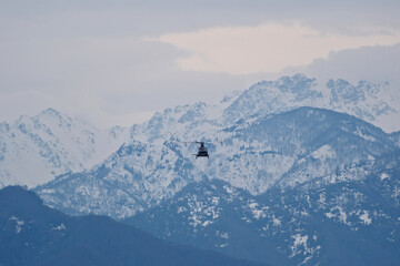 Helicopter Flying Over Snow-Capped Caucasus Mountains in Winter, Georgia