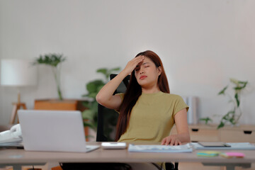 Tired asian business woman overworking&nbsp;and headache