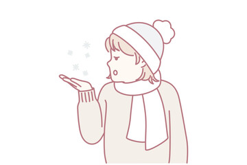 Little teen girl stretches out palm to pick up snowflakes standing outdoors in cold weather. Child in hat and scarf enjoys winter holidays and looks with surprise at falling snow. Flat vector image