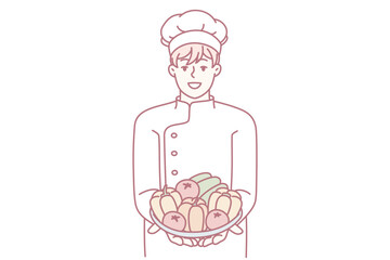 Satisfied man in chef clothes holds plate with fresh vegetables in hands offering to make vegetable salad. Restaurant cook demonstrating ingredients for preparing vegetarian food. Flat vector design