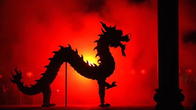 A silhouetted dragon dances against a fiery red backdrop, surrounded by smoke and lanterns