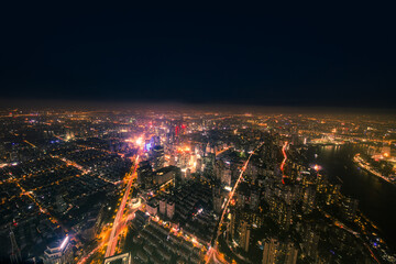 Obraz premium City Skyline Overlooking the Night - Aerial Urban Lights