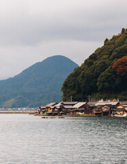Ine Fishing Village, Kyoto prefecture, Japan, Ine-ura landscape coastal view, Funaya, traditional wooden boat houses, Ine Bay during boat tour cruise, Yoza District, in a autumn fall day