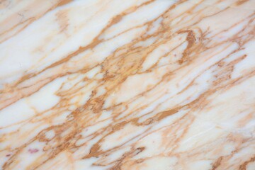 Beautiful marble surface showcasing rich patterns in warm tones from nature's artistry