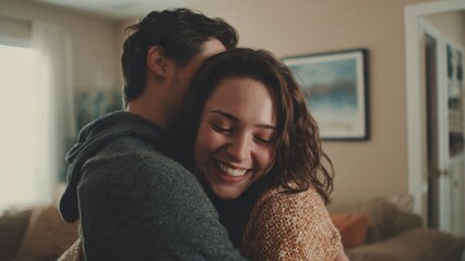Obraz premium Couple embracing indoors with joy