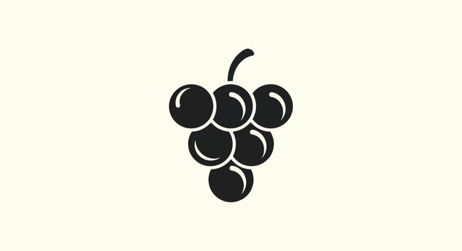 Black grape bunch on cream background