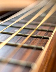 Macro shot of acoustic guitar strings and wooden fretboard with warm ambient lighting