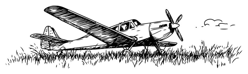 vintage propeller plane parked on grass © Kaz