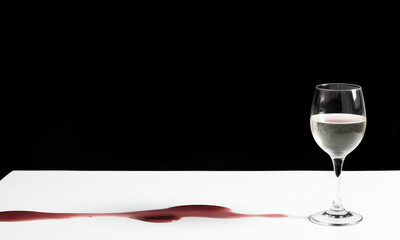 Gravity's Art: A Wine Glass with a Red Drip Trail