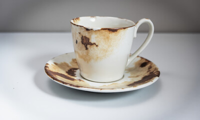 Poverty's Table: A Chipped Saucer and a Coffee Stain