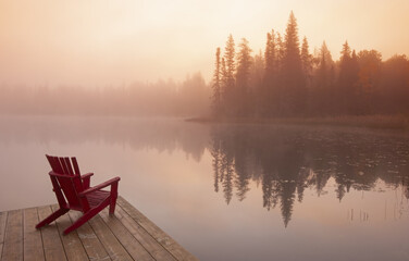 chair on dock,  Perch Lake, Duck Mountain Provincial Park, Manitoba, Canada