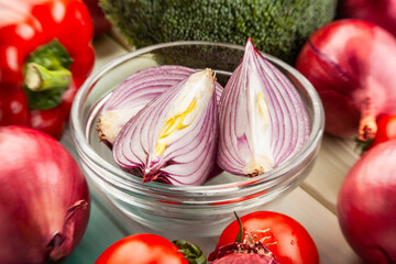 sliced red onion on wood background