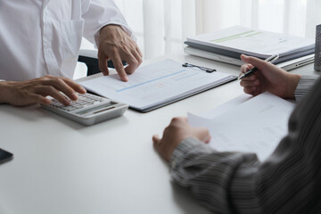 Professional accountant analyzing documents in office for precise valuation