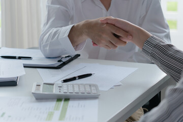 Business people Successful Ideas team shaking hands in Meeting room
