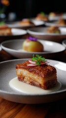 Crispy pork belly with creamy sauce in fine dining tasting menu