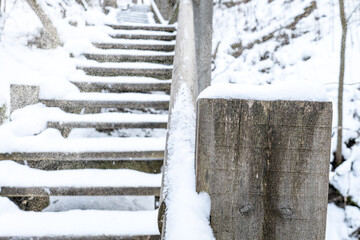 Close View Of Outdoor Steps Covered By Falling Snow Along Elevated Pathway In Cold Season