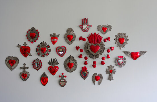 Collection of Mexican Red and Silver Tin Sacred Hearts