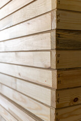 Stack of light wooden board with dovetail joint in carpentry workshop