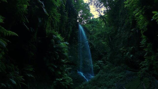 Aerial drone footage flying toward Cascada de Los Tilos waterfall in La Palma, Canary Islands