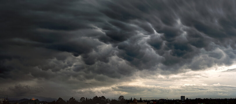 Dense Storm Clouds, Vibrant Sunset Puebla, Mexico

