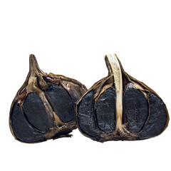 Black garlic halves displaying fermented superfood cloves
