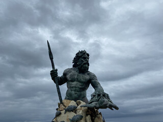 King Neptune Statue at Virginia Beach with Dramatic Storm Clouds © StoryStock