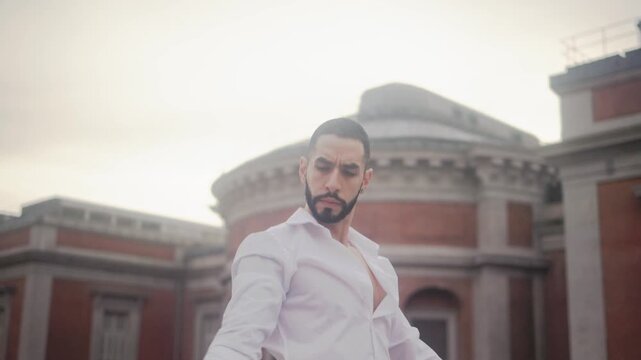 Passionate hispanic man performing expressive flamenco dance