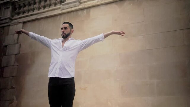 Hispanic man performing passionate flamenco dance in spain