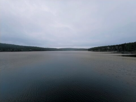 serene tranquil landscape, isolated wilderness setting with calm waters and subdued colors