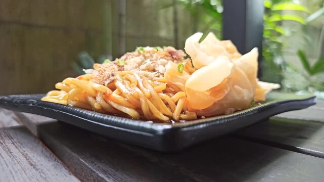 A plate of spicy fried noodles level 1 with rich seasoning and mild heat, still easy to enjoy while staying flavorful, warm, and satisfying for a simple meal.