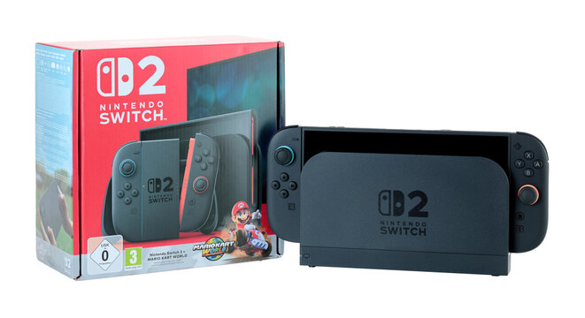 Nintendo Switch 2 gaming console in dock station with original retail packaging, isolated on transparent background