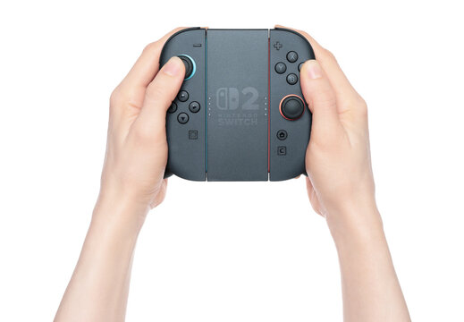 Hands holding a custom Nintendo Switch 2 controller made from Joy-Cons, isolated on transparent background