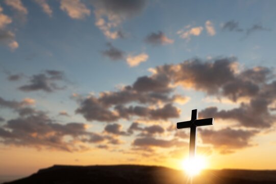 The christian Cross symbol of easter in bright sky