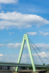 Fototapeta premium Modern Architecture of Severin Bridge in Cologne Germany with Iconic Green A-Frame Pylon over the Rhine River