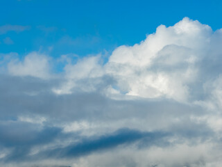 Fototapeta premium Bright Blue Sky With White Clouds Over Calm Horizon in Howe Sound, BC, Canada