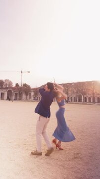 Passionate hispanic couple dancing bachata in aranjuez spain