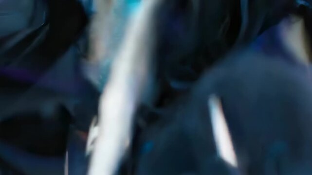 Abstract, glossy, multifaceted shapes in shades of blue with highlights