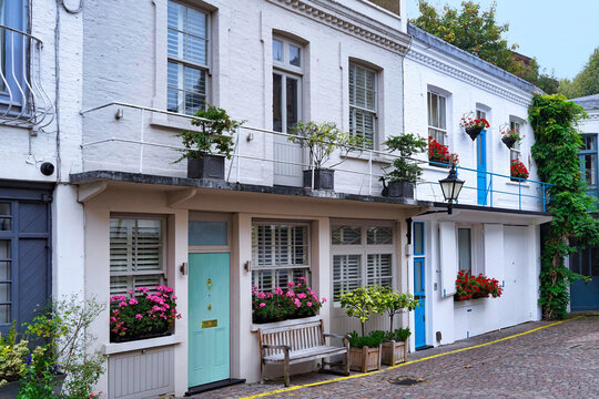 London, Kensington, mews houses with colorful flowers
