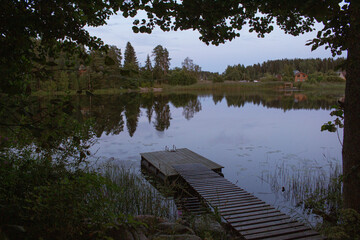 wooden bridge over lake in Russia