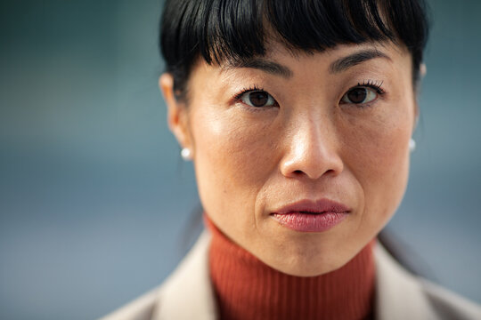 Confident businesswoman close-up portrait outdoors